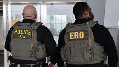 Immigration and Customs Enforcement (ICE) agents patrol Terminal B at LaGuardia Airport on March 23, 2026 