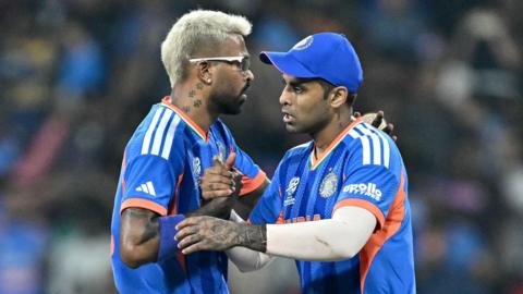 India's Hardik Pandya (L) and captain Suryakumar Yadav celebrate after their team's win at the end of the 2026 ICC Men's T20 Cricket World Cup group stage match between India and Pakistan in the R Premadasa Stadium, Colombo