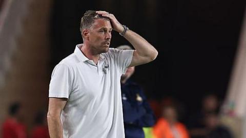 Boro boss Rob Edwards with head in hand as his side are beaten by Doncaster