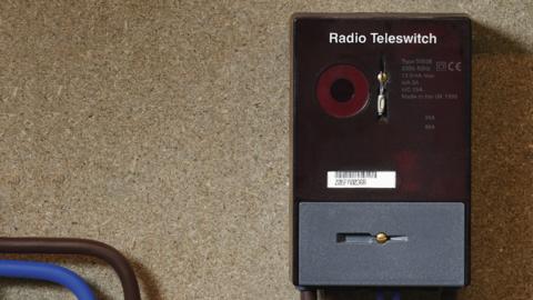 A black Radio Teleswitching System (RTS) box on a board