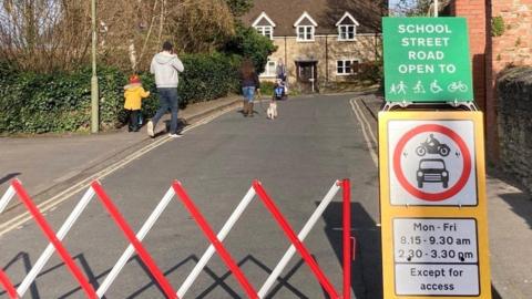 school streets barrier with road closure sign