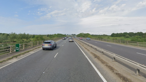 Google street view image of the A47 near Postwick. It shows cars travelling on dual carriageways in both directions.