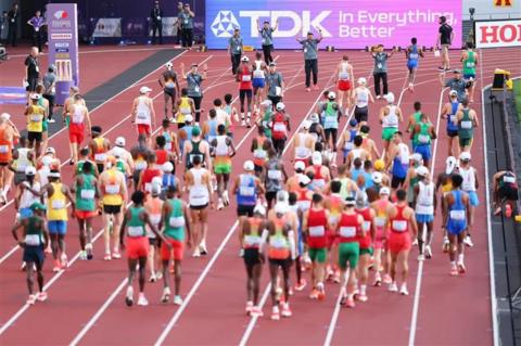 Marathon runners being stopped on the track after a false start