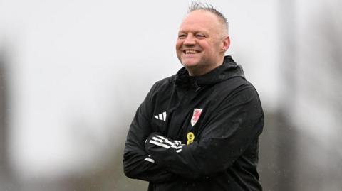 Jon Grey smiles during training 