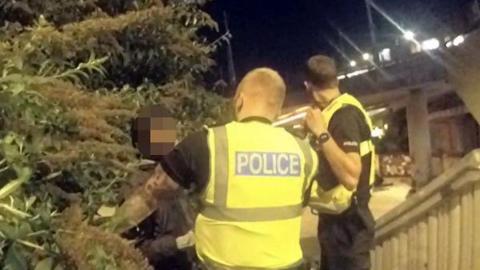 Police officers at a skatepark 