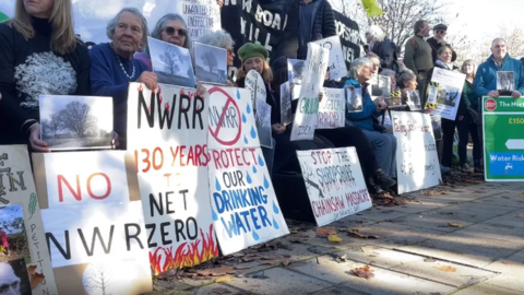 Protestors holding placards outside Shirehall, Shrewsbury