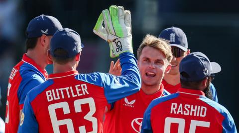 England players celebrate a wicket