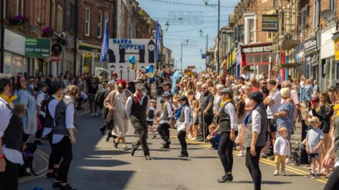 One of the acts performing on Senhouse Street in Maryport for a past carnival