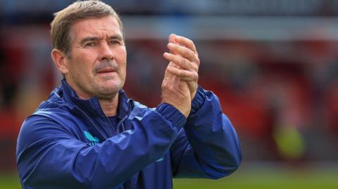 Mansfield Town boss Nigel Clough claps