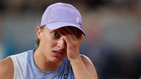 Iga Swiatek reacts during her French Open semi-final defeat by Aryna Sabalenka