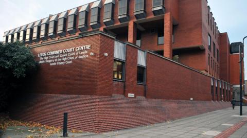 Leeds Combined Court building - a red brick, multi-storey building.