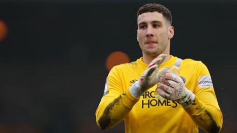 Marko Marosi in his yellow goalkeeper's shirt 