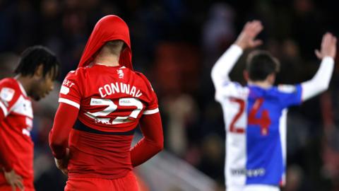 Tommy Conway puts his shirt above his head after Middlesbrough concede the winning goal to Blackburn Rovers