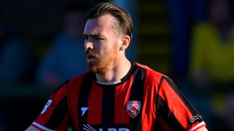 Jack Nolan in action for Morecambe.