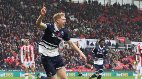 Josh Coburn celebrating during Millwall's game against Stoke City last season