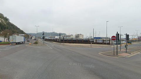 A road junction with a ferry port in the background