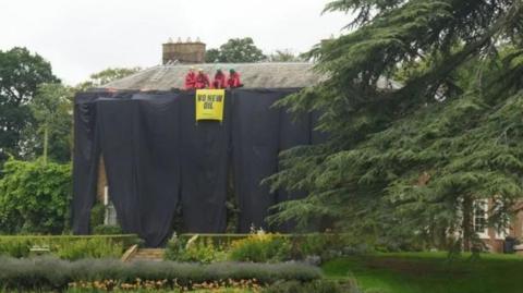 Activists climbed up to the roof of the PM's North Yorkshire home and unfurled banners in August