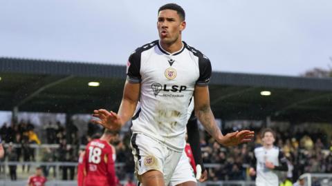 Omar Sowunmi celebrates scoring for Bromley against Salford City