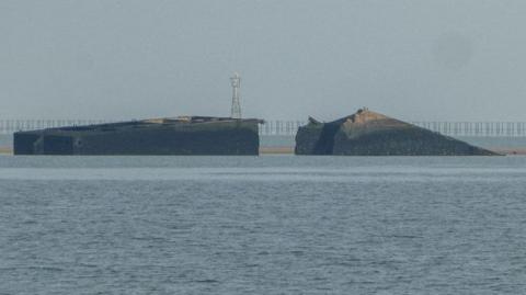 The remains of a D-Day Mulberry Harbour in the sea of Thorpe Bay, Essex