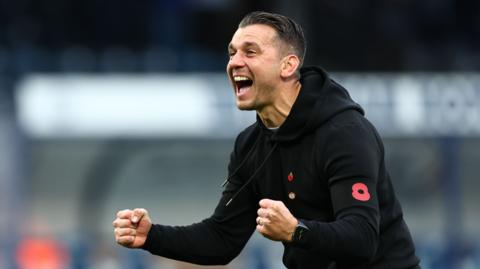 Wycombe boss Matt Bloomfield celebrates