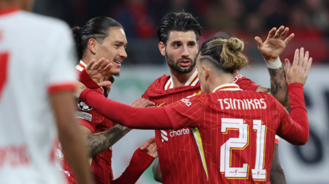 Liverpool's players celebrate after scoring against RB Leipzig