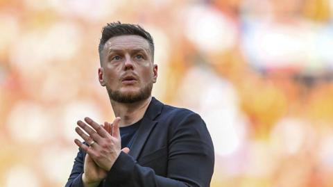 Kim Hellberg applauds fans after losing to Hull at Wembley