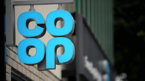 A blue Co-op sign outside a shop