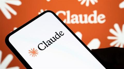 Claude on a mobile phone with orange branded background 