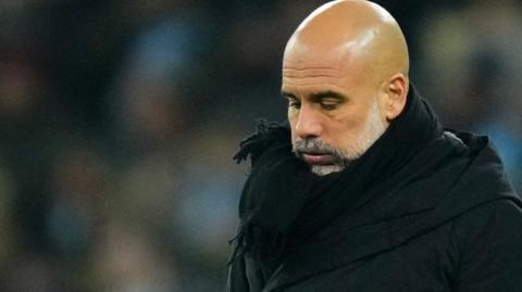 Manchester City manager Pep Guardiola looks down after his side's Champions League defeat by Real Madrid