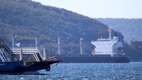 Ships pass through the Dardanelles Strait near the Turkish city of Canakkale. Photo: August 2022