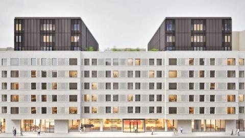 Architectural rendering of a modern multi-storey building with patterned white facade, large windows, and three dark upper blocks, designed for student accommodation.