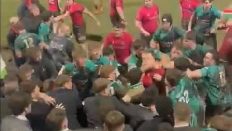 Blurry video footage showing a fight between Cardiff and Swansea university players