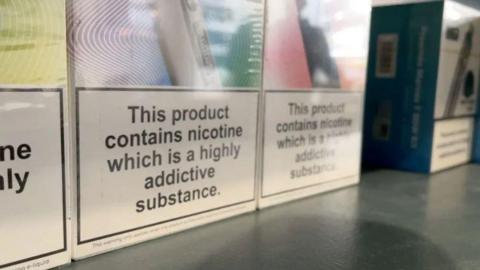 A series of vape products on a shelf