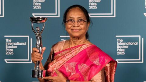 Winner of the International Booker Prize 2025 author Banu Mushtaq poses with the trophy during the award ceremony at Tate Modern in London, United Kingdom on May 20, 2025. The International Booker Prize is awarded annually for the finest single work of fiction from around the world which has been translated into English and published in the UK and Ireland.