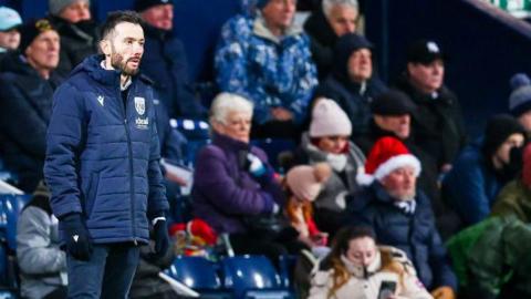  Carlos Corberan observes quietly during Sunday's 2-0 win over Bristol City 