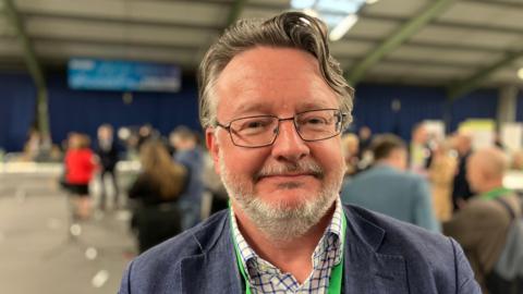 Head and shoulders shot of Derbyshire County Council leader Barry Lewis 