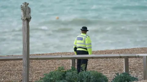 Emergency services at the scene on Madeira Drive, Brighton. The bodies of three women were recovered from the sea in Brighton early today, Sussex Police said. 