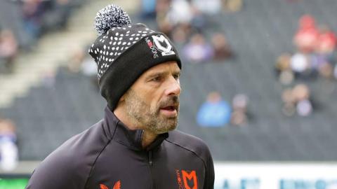 MK Dons head coach Paul Warne on the touchline