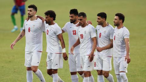 Members of the Iranian football squad are pictured walking on the pitch in a white football kit, at a friendly match in Turkey on 29 May 2026.