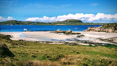 a sunny beach with blue sea