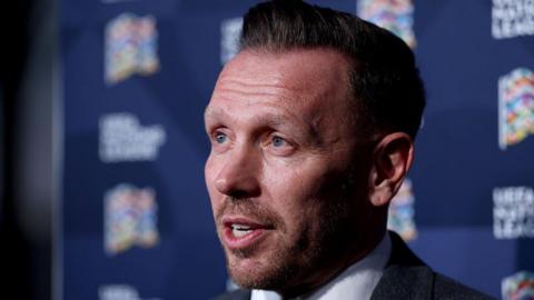 Craig Bellamy is interviewed at the Nations League draw in Brussels