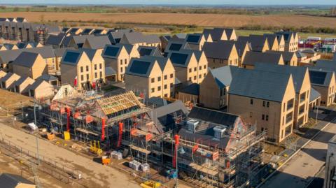 Drone view of a residential building site under construction