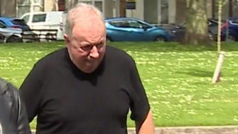 Jeff Lane walking outside Swansea Crown Court