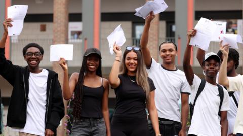 Students receive their A-level results at a school in south London