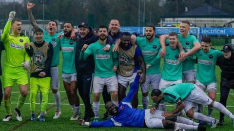 Nuneton's players celebrate after winning the Midland League