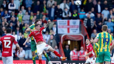 West Bromwich Albion defender Nat Phillips and Bristol City forward Emil Riis battle for the ball