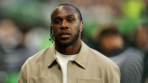 Michail Antonio wearing a beige jacket