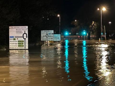 The roads around The Bridge Centre roundabout in Chippenham are flooded