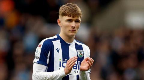 Oliver Bostock applauds after a West Brom game this season 