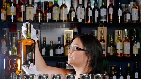 woman with whisky bottle